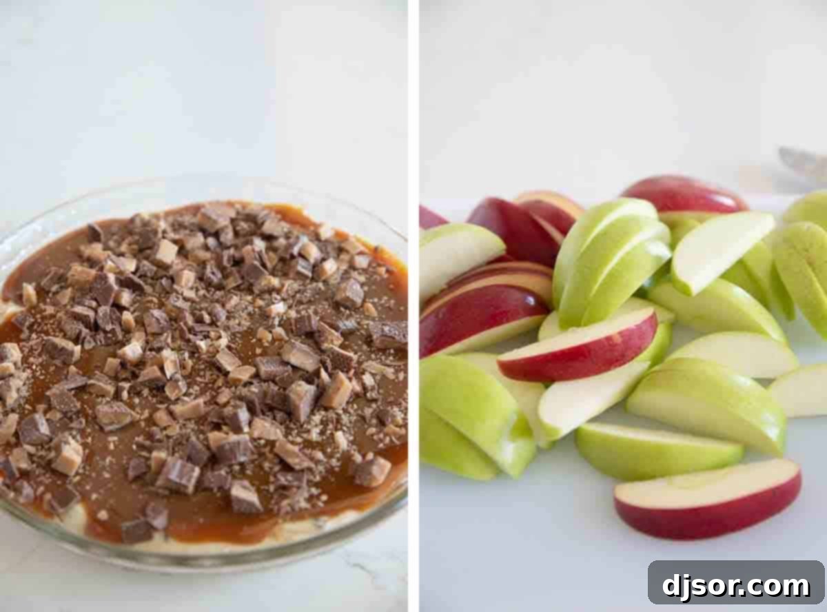 Caramel Apple Dip beautifully topped with chopped toffee pieces and surrounded by freshly sliced apples, ready for serving.