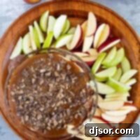 Caramel Apple Dip with red and green sliced apples for dipping.