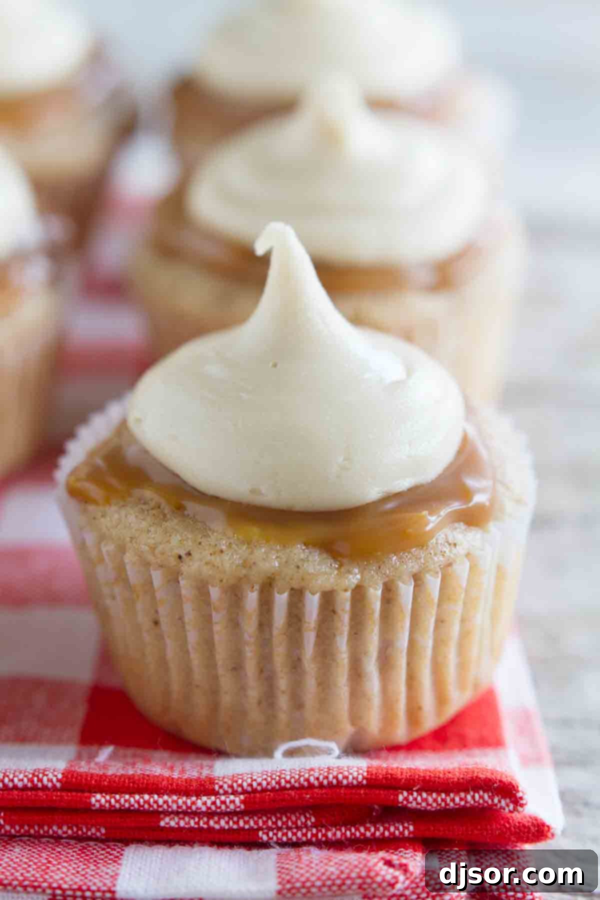 Caramel Apple Cupcakes topped with caramel and buttercream