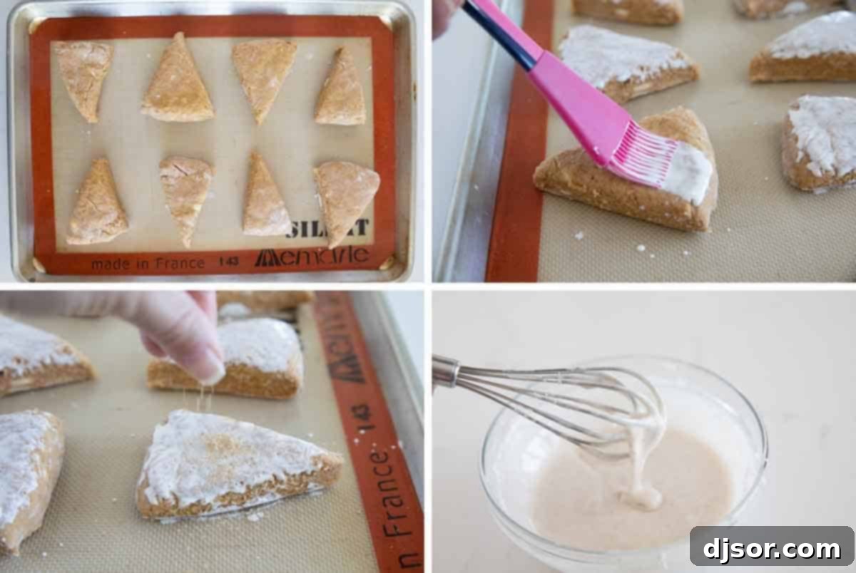 Perfect for breakfast or as an afternoon snack, these Pumpkin Scones are tender and full of fall flavor. They are perfectly light, fluffy, and moist. Freshly baked pumpkin scones on a baking sheet, ready for the final touch of icing.