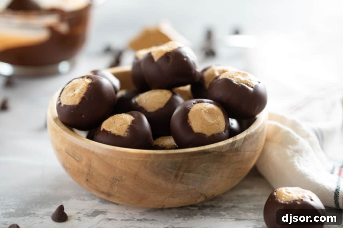 The Ultimate No-Bake Buckeye Recipe: A Chocolate Peanut Butter Delight Wooden bowl filled with buckeyes, ready to be enjoyed.