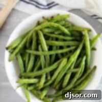 Crispy Air Fryer Green Beans 2 Bowl of green beans cooked in the air fryer in a bowl.