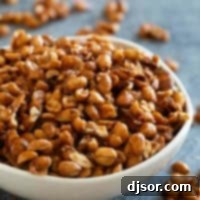 White bowl filled with toffee peanuts.