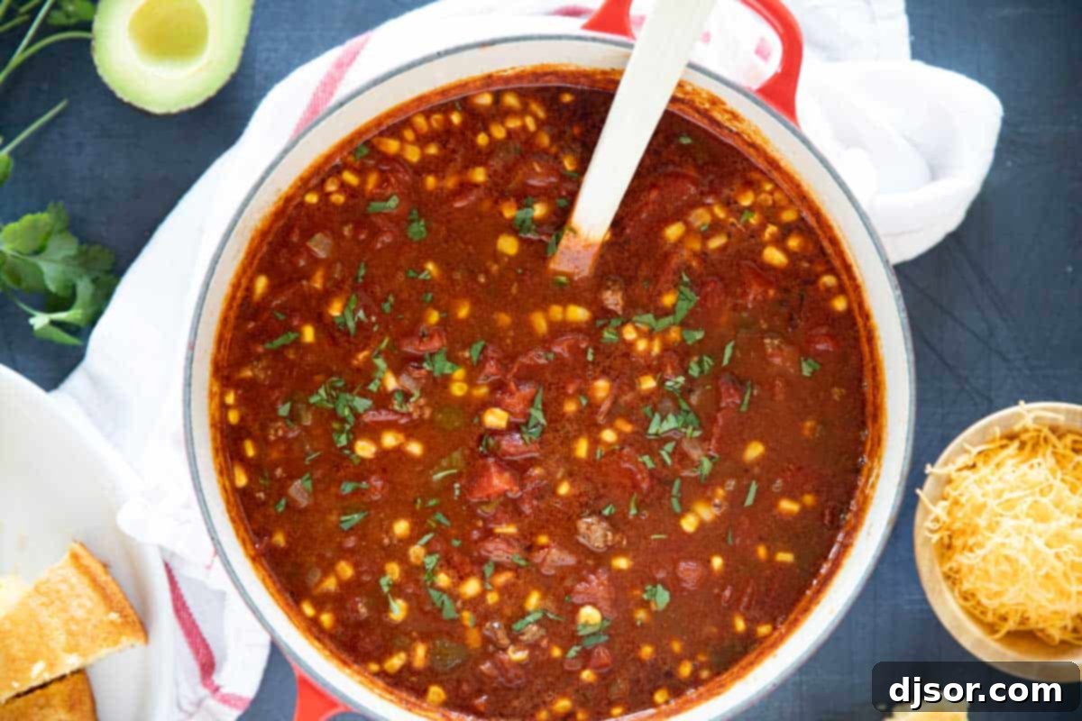 Delicious Taco Soup in a Pot, Garnished with Cilantro A large pot of freshly made Taco Soup, garnished with vibrant cilantro, ready to be served.