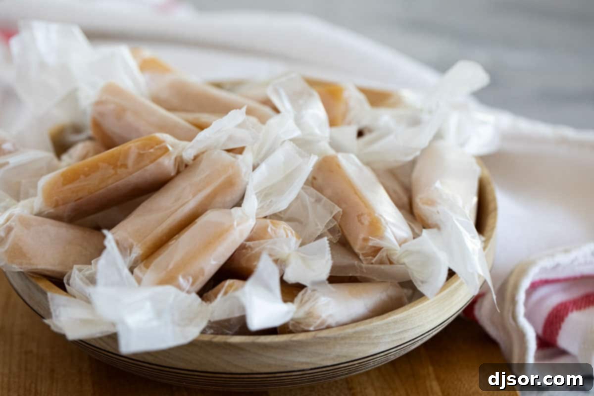 Perfect every time, these microwave caramels couldn’t get much easier! A few minutes of hands on time and you have caramel candy that tastes like you bought it at a fancy candy store. Wrapped caramel candy in a wooden bowl.