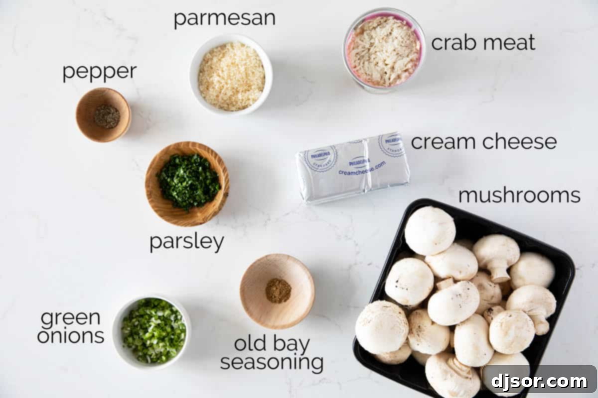A selection of fresh ingredients including cream cheese, Parmesan, green onions, parsley, Old Bay seasoning, and fresh crab meat, ready for making Crab Stuffed Mushrooms.
