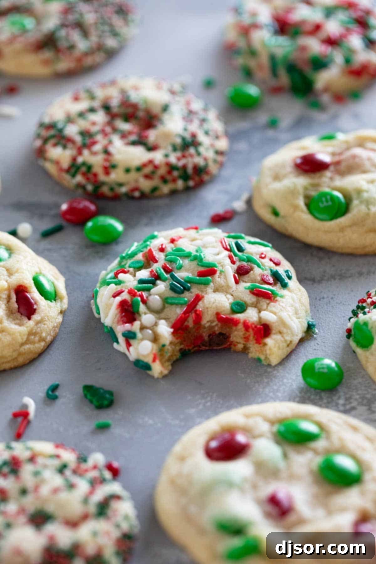 Soft, delicious, and super festive, these Christmas M&M Cookies will be a favorite for both kids and adults. Add sprinkles to make them even more fun! A festive display of Christmas M&M cookies with colorful sprinkles, perfectly arranged for a holiday celebration.