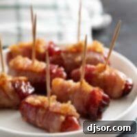 Bacon Wrapped Smokies with toothpicks on a plate.