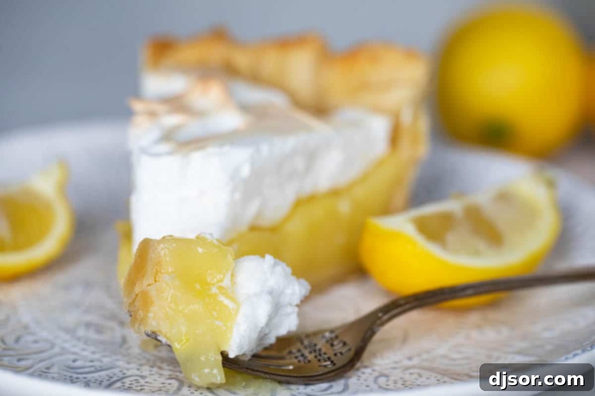 bite of lemon meringue pie on a fork