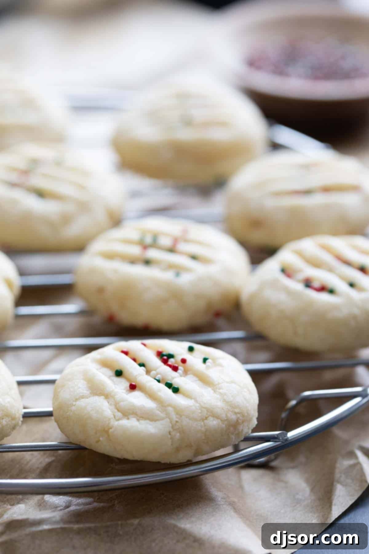 Freshly baked Christmas Shortbread Cookies cooling on a wire rack.
