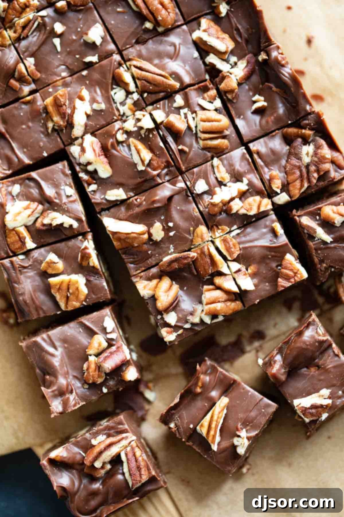 Easy fudge recipe cut into squares and topped with pecans, ready to be served or gifted.