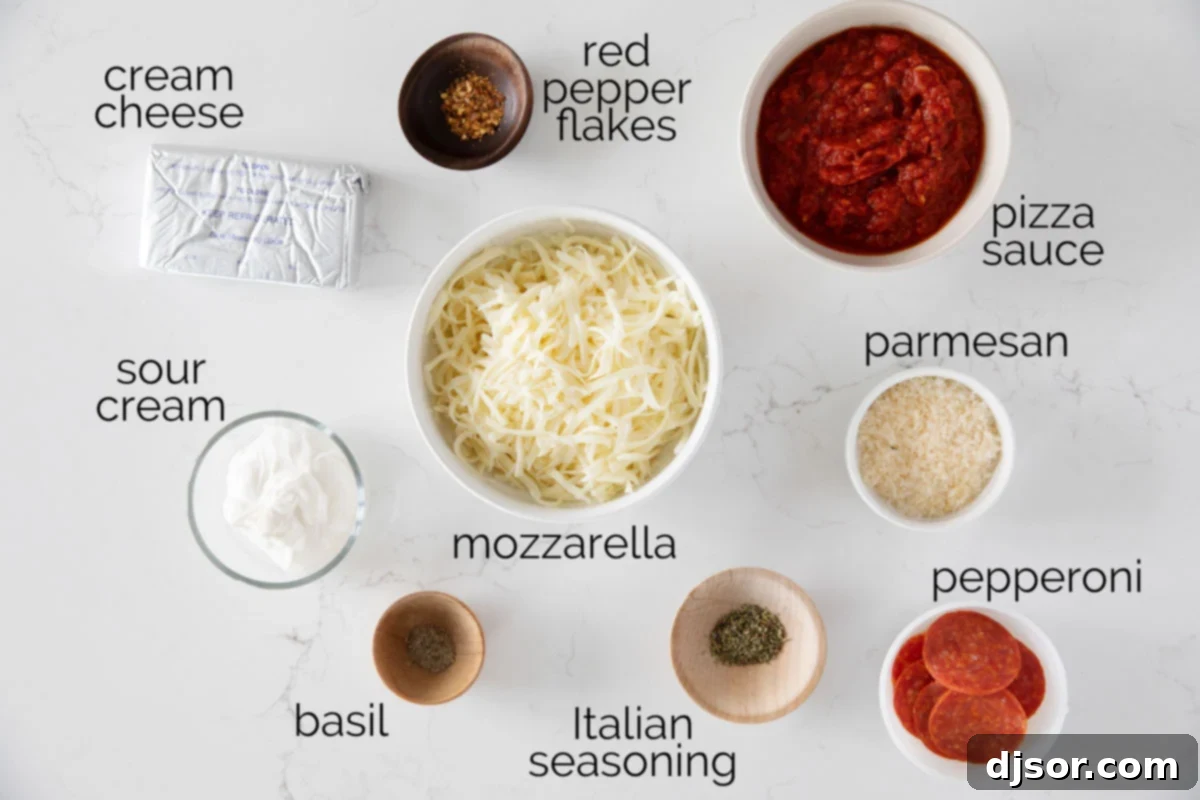 All the fresh ingredients laid out on a wooden board, ready to make Pepperoni Pizza Dip.