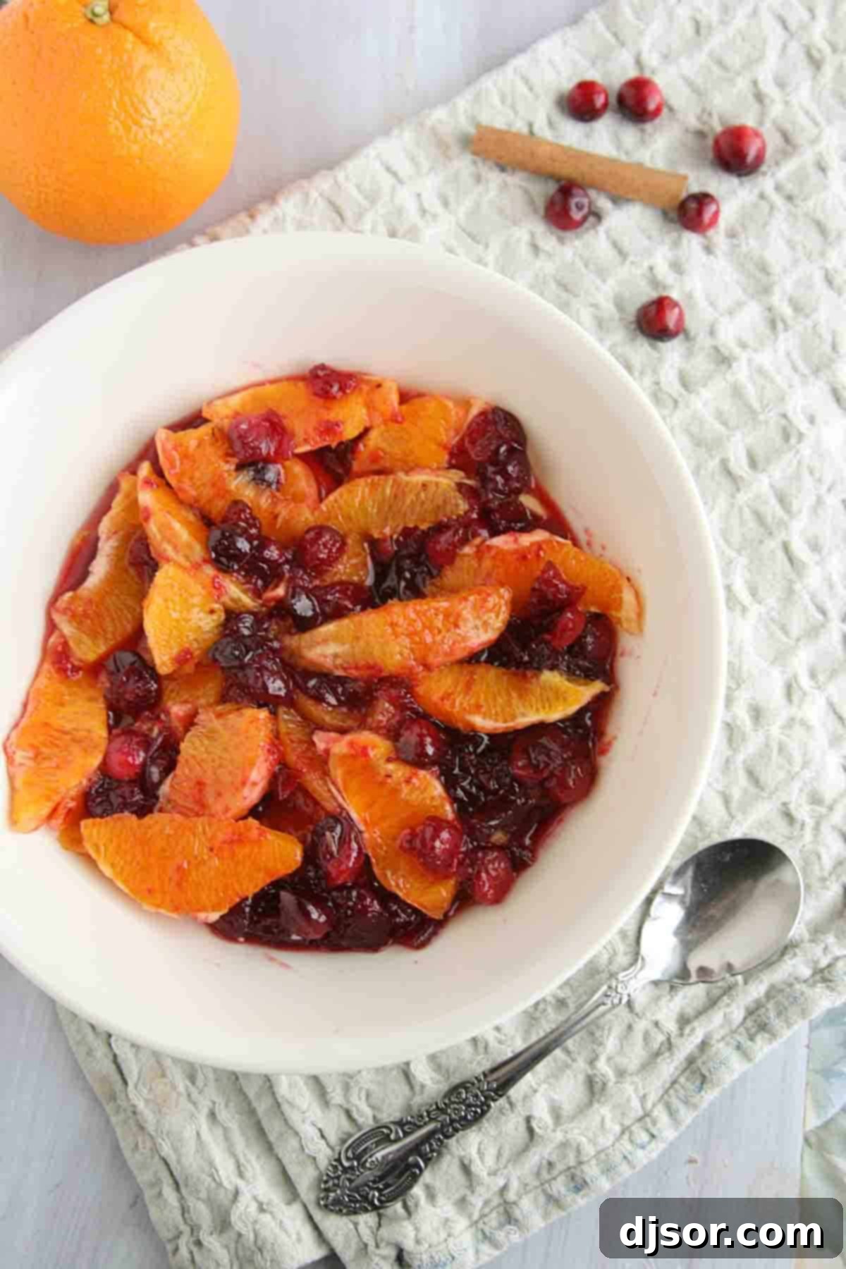 A perfect Thanksgiving side dish – this Orange Compote with Candied Cranberries is a great change up to the ordinary cranberry sauce! A beautiful bowl of homemade orange compote with sparkling candied cranberries, garnished with fresh orange zest.