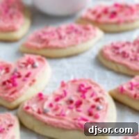 Sweetheart Sugar Cookies 2 Shaped Valentine's day sugar cookies with pink buttercream frosting.
