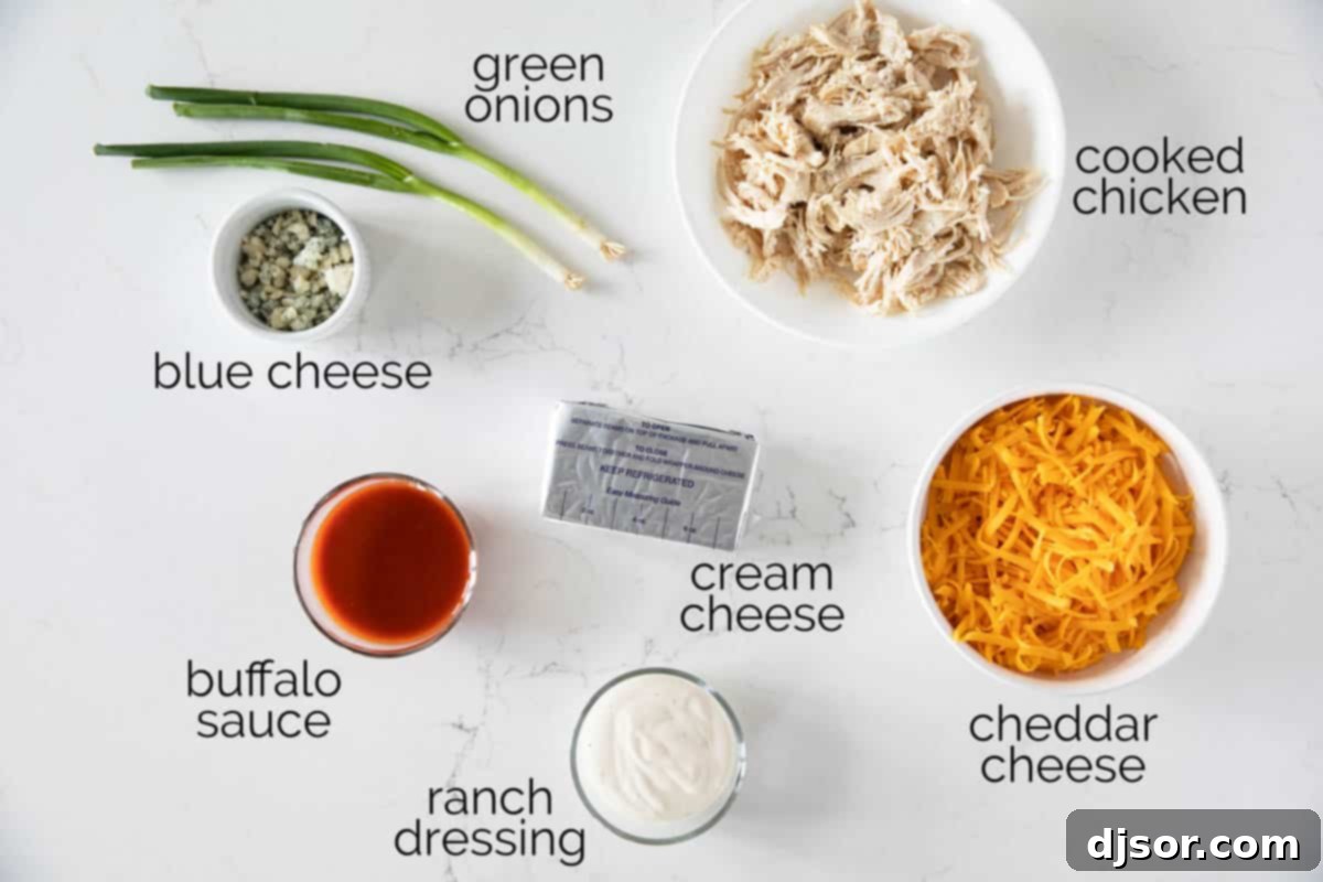 Ingredients to make Buffalo Chicken Dip. A classic game day appetizer, this Buffalo Chicken Dip is so popular for a reason! Filled with all of your favorite buffalo chicken flavors, this dip is super easy to make and always disappears.