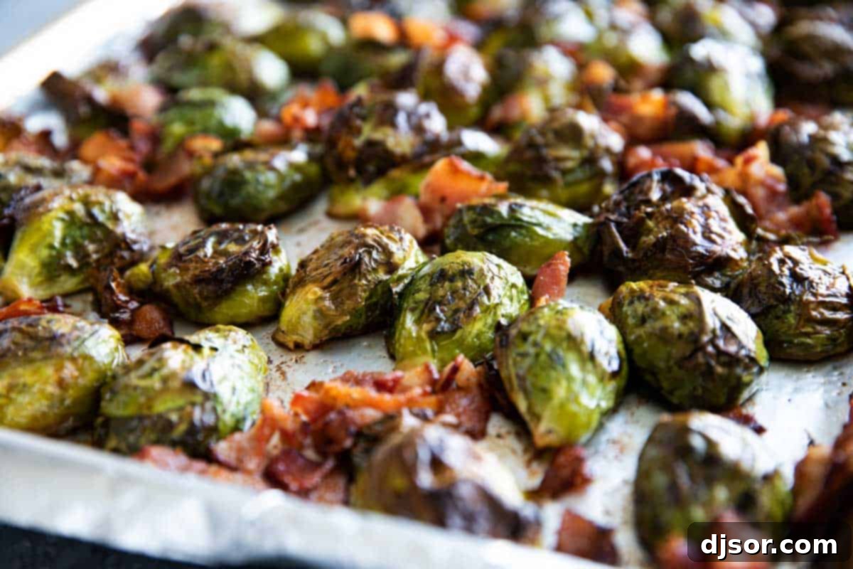 The tastiest - and easiest - way to prepare Brussels sprouts, these Roasted Brussels Sprouts are always a hit. They only take a few minutes to prepare, and everyone loves them. Perfectly golden-brown roasted Brussels sprouts with crispy bacon pieces on a baking sheet, fresh out of the oven.