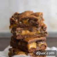 Caramel Brownies stacked on top of each other.