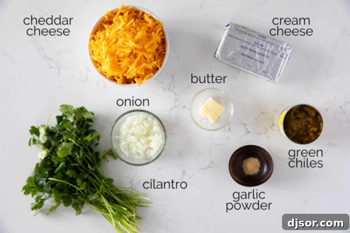Fiesta Cheese Ball 3 A close-up shot of all the fresh ingredients laid out on a wooden board, ready to be mixed into the Southwest Cheese Ball.