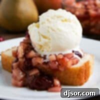 Cranberry Sauce over Pound Cake with ice cream on a plate
