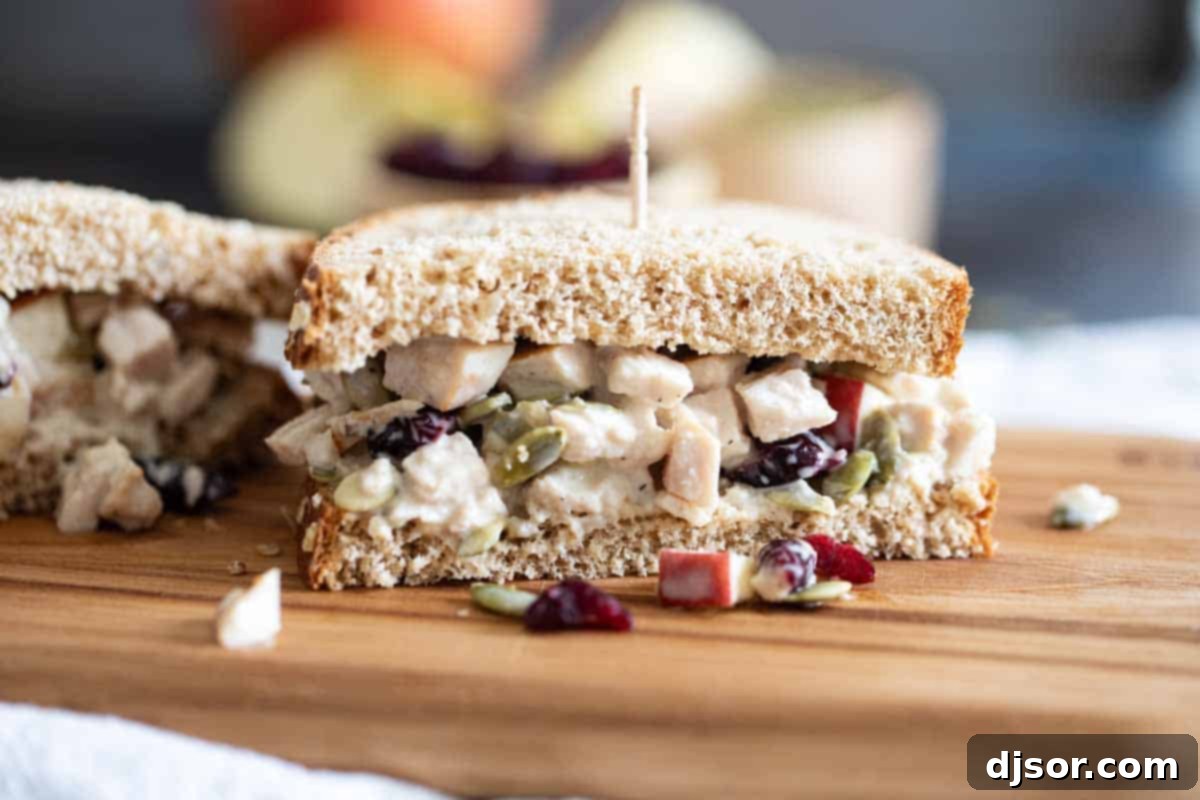 Honey Mustard Turkey Salad Sandwich: A delightful way to repurpose leftover turkey, perfect for any meal. A perfectly cut Turkey Salad Sandwich with Honey Mustard, showcasing the filling and golden-brown bread, ready to be enjoyed.