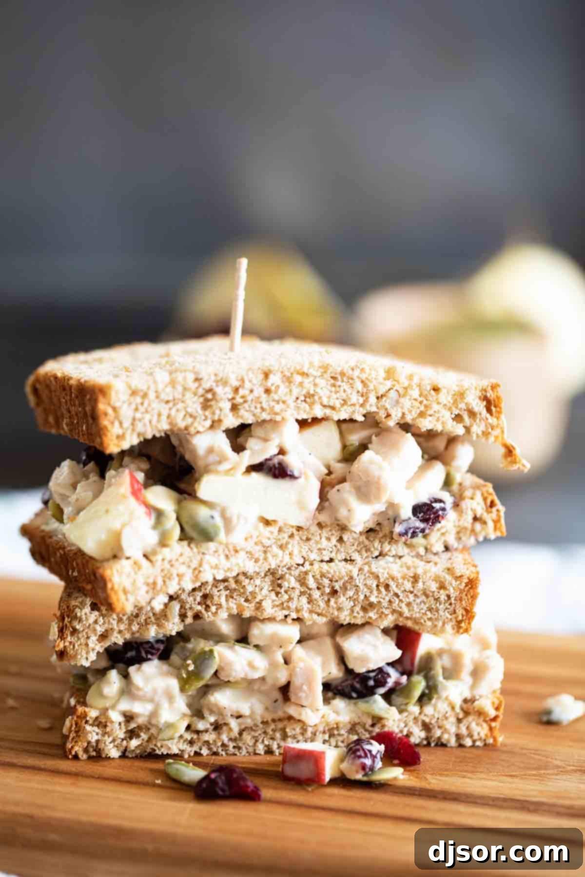 The ultimate Honey Mustard Turkey Salad Sandwich, ready to savor. Two halves of a Honey Mustard Turkey Salad Sandwich, stacked artfully, showcasing the generous filling and the beautiful mix of ingredients, ready to be enjoyed.