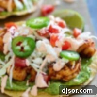 Easy spicy shrimp tostadas with guacamole and a spicy sauce.