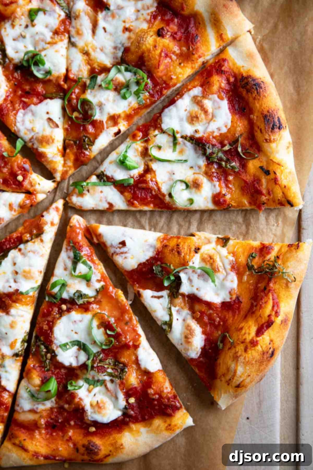 Savoring Your Homemade Margherita Pizza Sliced margherita pizza topped with mozzarella and basil, ready to eat.