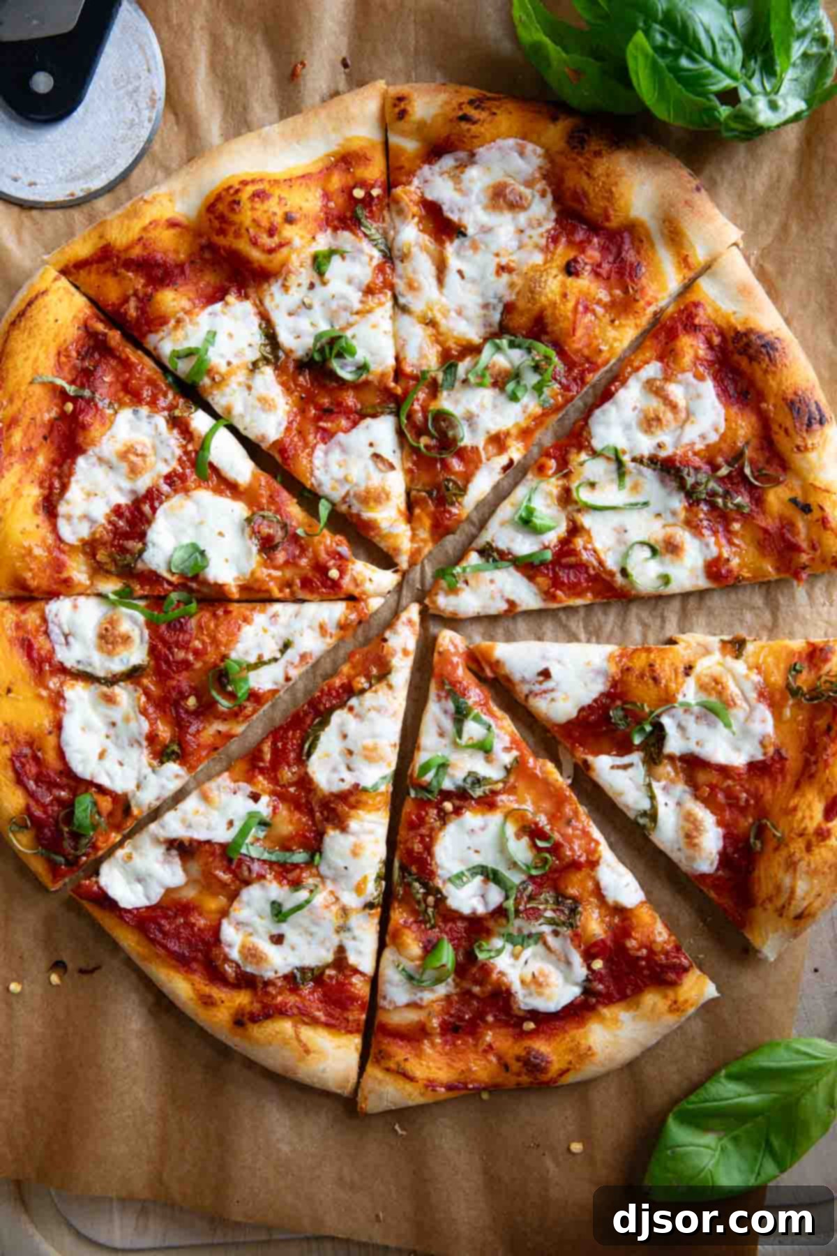 Indulge in Homemade Margherita Pizza Full Margherita Pizza cut into 8 slices, ready for serving.