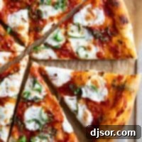 Authentic Margherita Perfection 2 Sliced margherita pizza topped with mozzarella and basil.