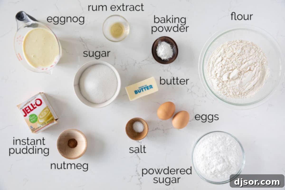 A collection of fresh ingredients laid out on a surface, including flour, eggs, butter, nutmeg, and a carton of eggnog, all ready to be transformed into a delicious Eggnog Bread.