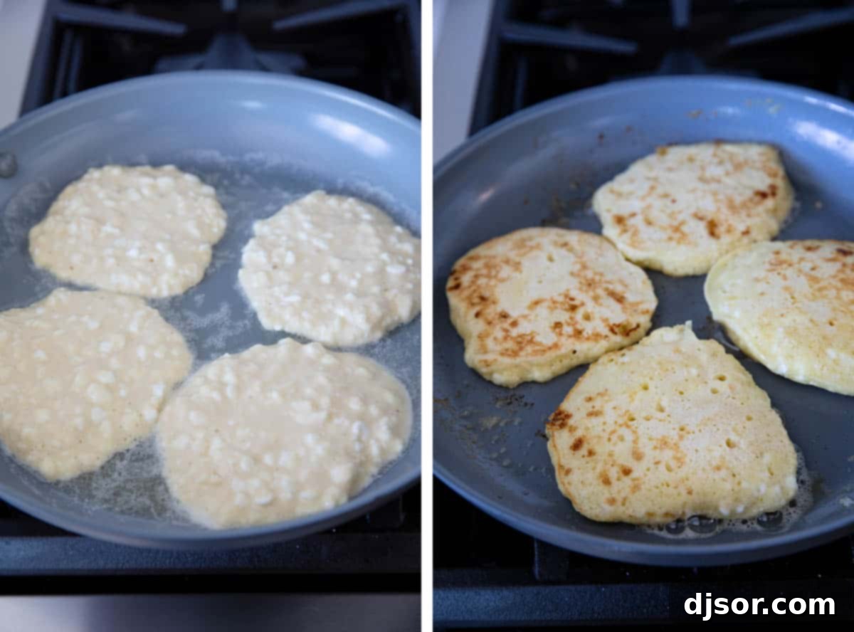 Cottage cheese pancakes cooking on a nonstick skillet, bubbling around the edges.