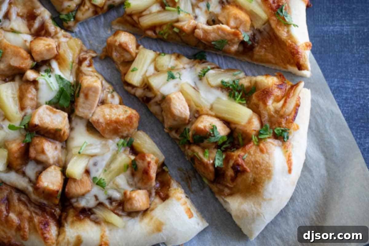 A vibrant and delicious Teriyaki Chicken Pizza Overhead view of a freshly baked Teriyaki Chicken Pizza, garnished with cilantro, ready to be served