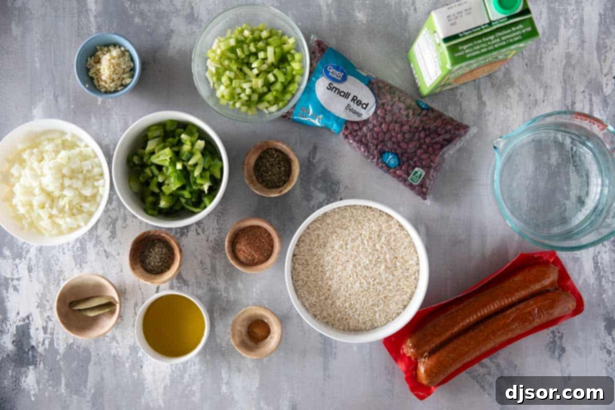 Andouille Red Beans and Rice 3 Fresh ingredients laid out for making Red Beans and Rice with Andouille Sausage: dry red beans, vegetables, spices, and sausage.