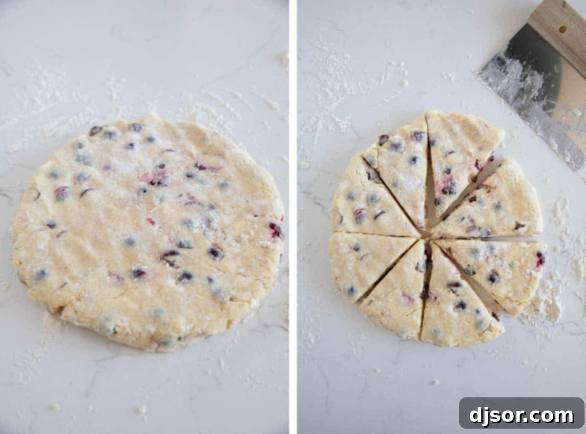 Scone dough being shaped into a disc and then cut into 8 uniform wedges on a floured surface.