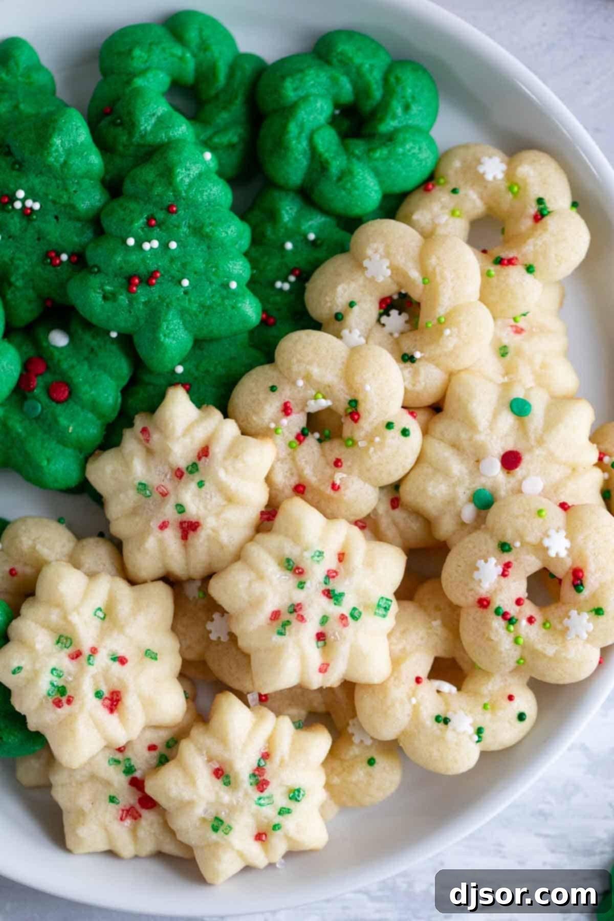 Homemade Spritz Cookies A Step-by-Step Guide 7 Close up of spritz cookies on a plate.