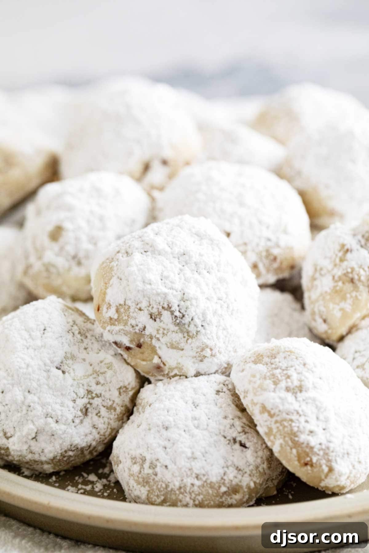 Snowball cookies dusted with powdered sugar.
