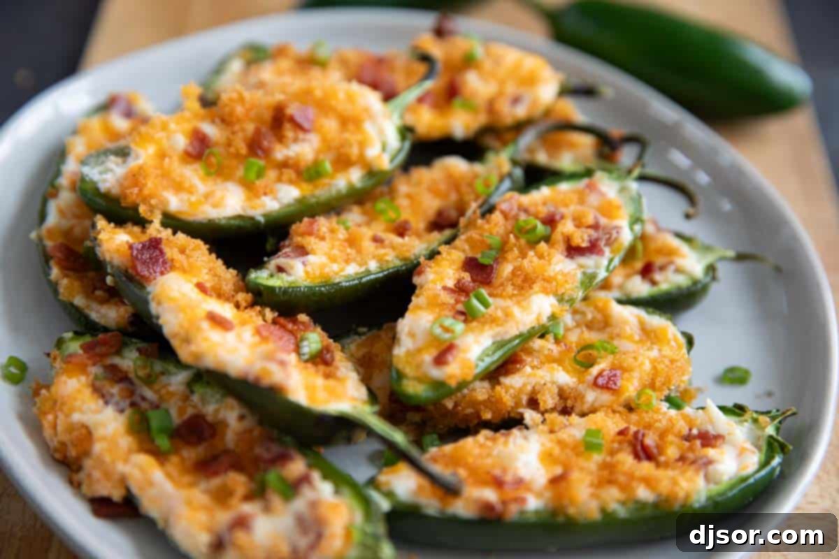 Jalapeño Poppers stacked on a plate for serving.