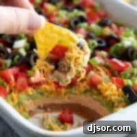 Tortilla chip with 7 layer dip.