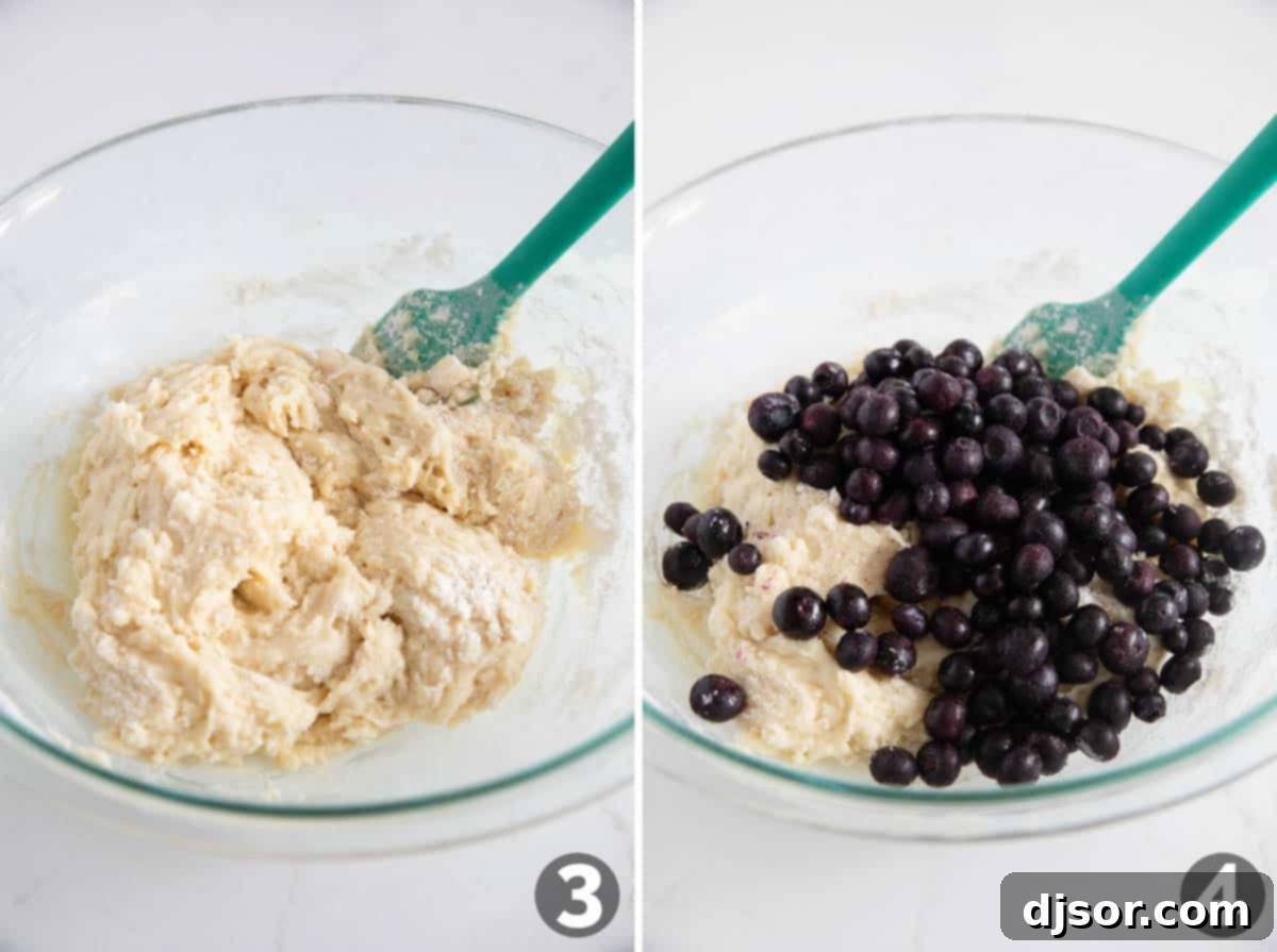Close-up of adding fresh blueberries to the muffin batter.