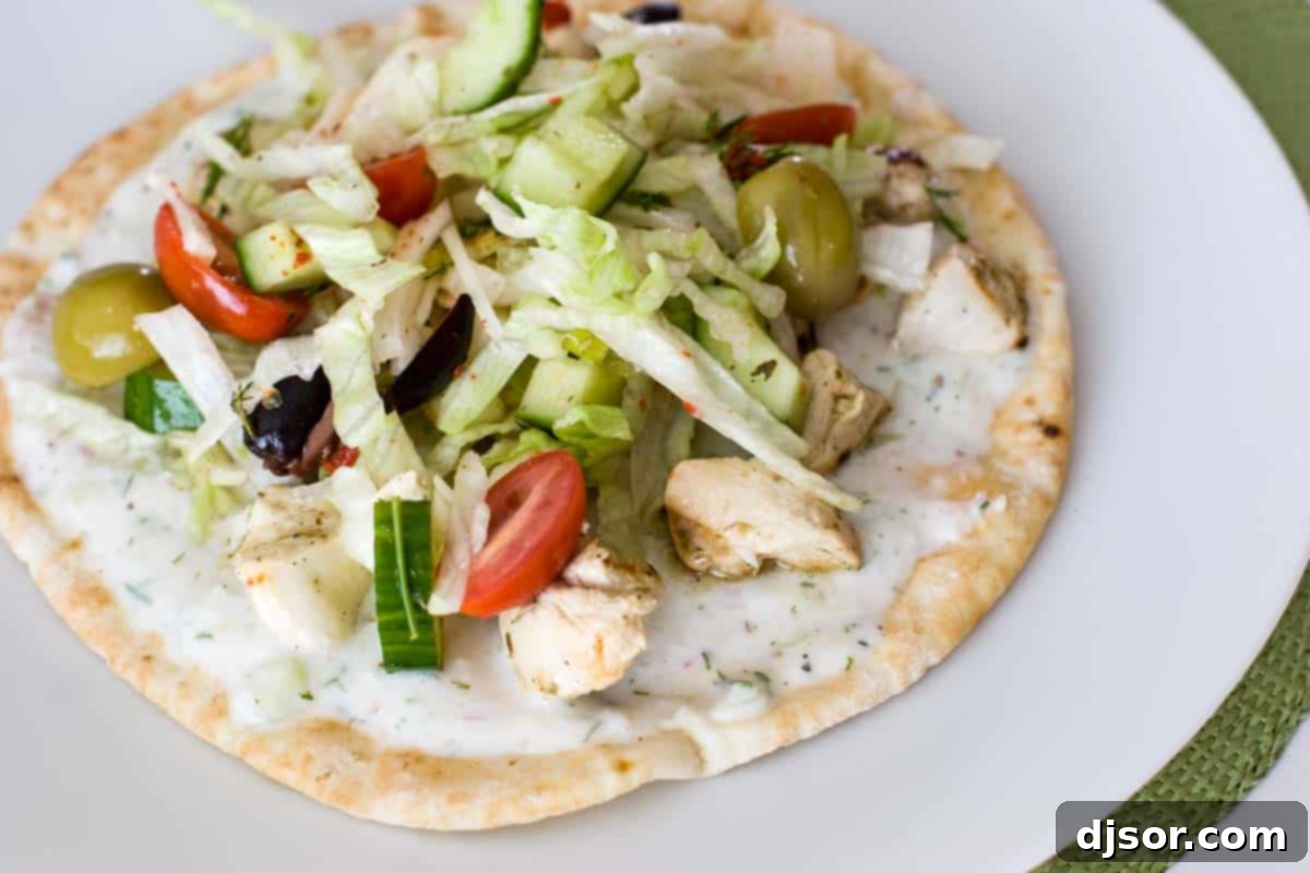 Overhead view of Souvlaki: Chicken Shish Kebab, beautifully arranged to highlight the fresh ingredients and vibrant colors.