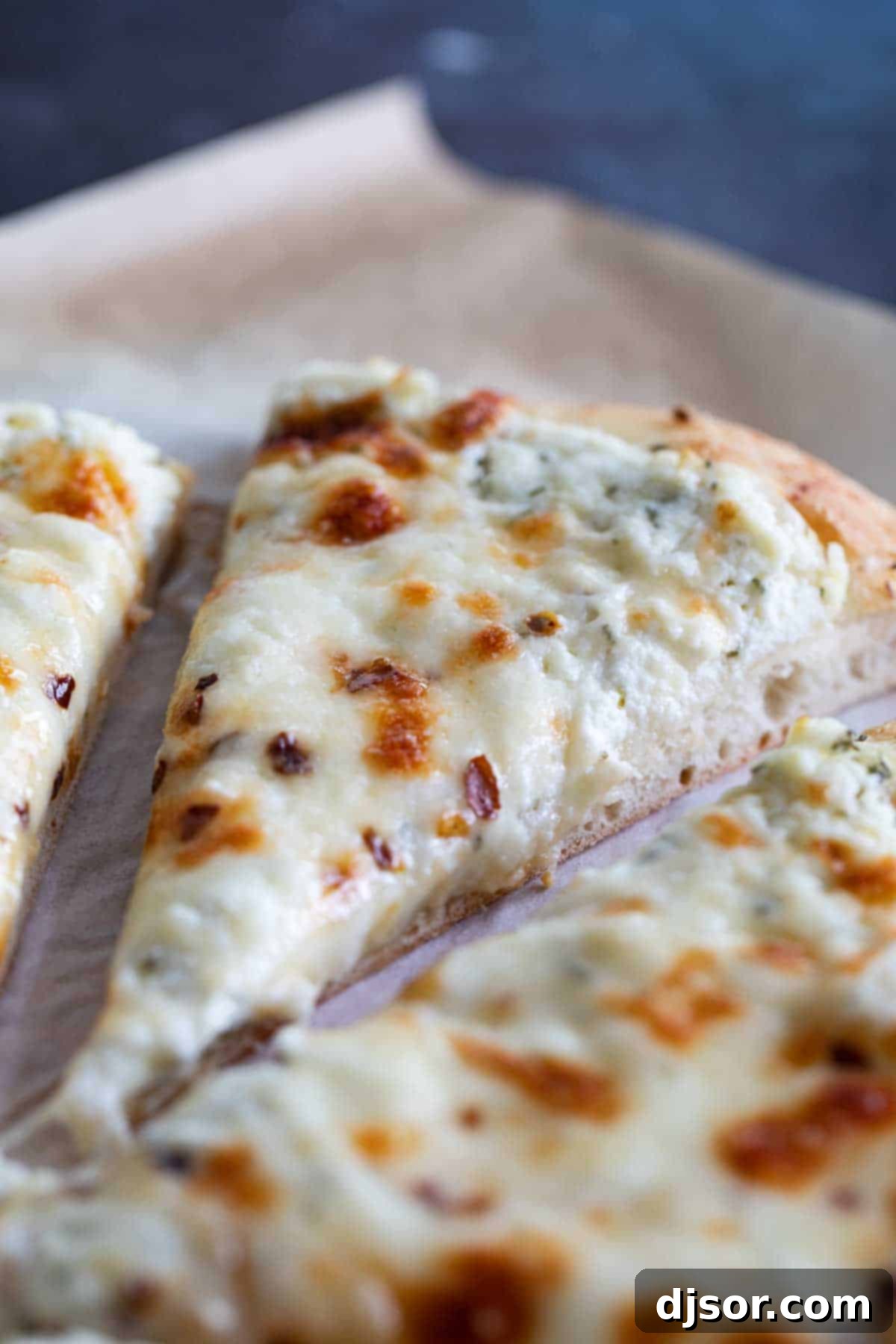 Irresistible Close-Up of Our Gourmet White Pizza close up of white pizza