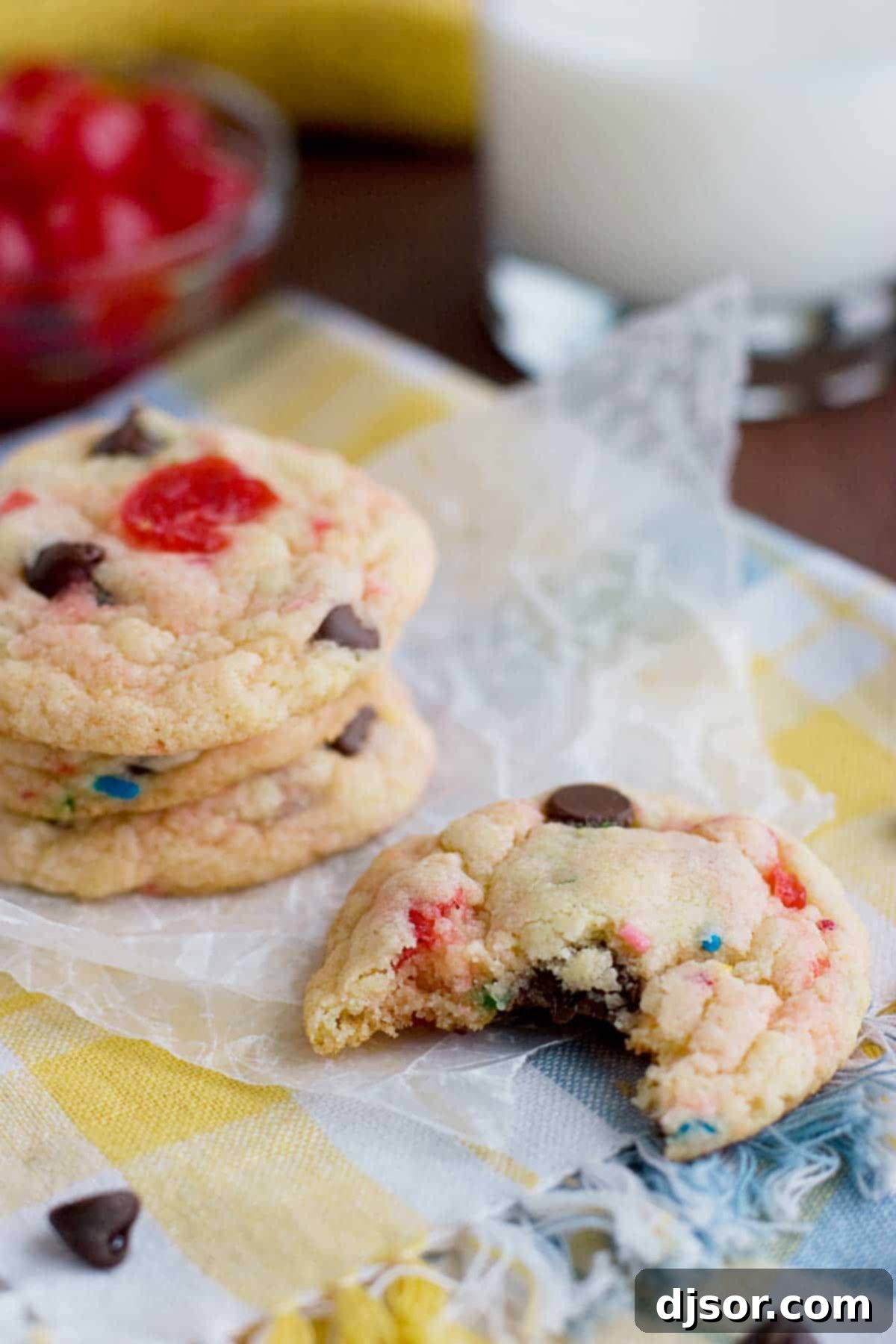Fun Banana Split Cake Mix Cookies 3 Close-up of a Banana Split Cake Mix Cookie with a bite taken, showing its soft texture and inclusions.