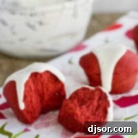 Red Velvet Roll torn in half to show texture.