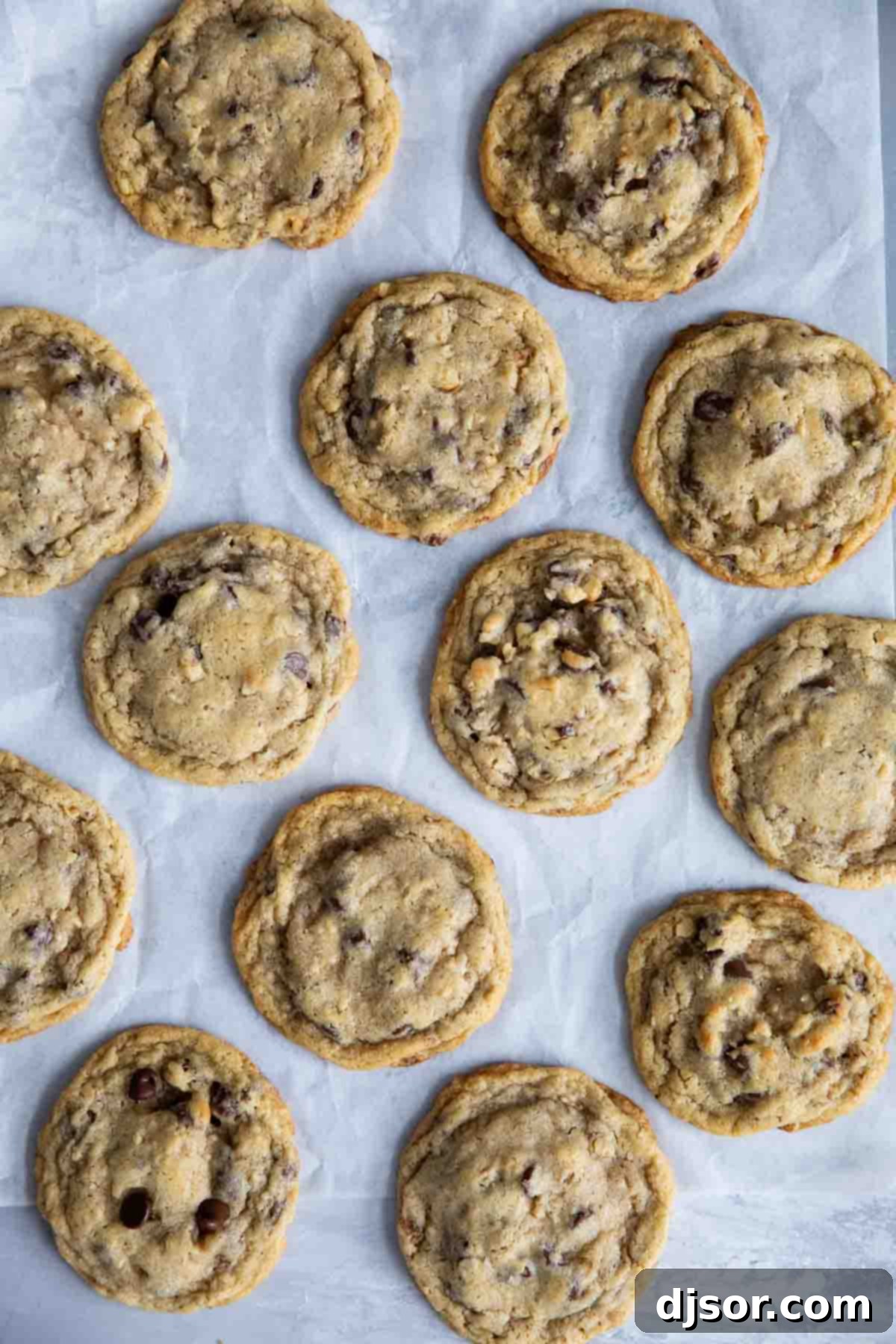 Doubletree Cookie dough balls placed on parchment paper, ready for baking.