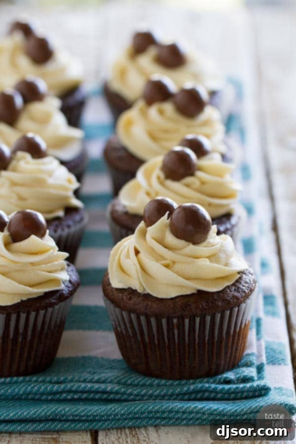 Close-up shot of a Chocolate Malt Cupcake with Vanilla Malt Buttercream, highlighting the texture and generous frosting.