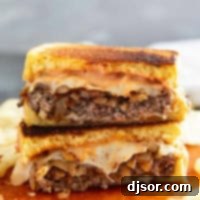 Classic Patty Melt 9 Patty Melt cut in half and stacked.