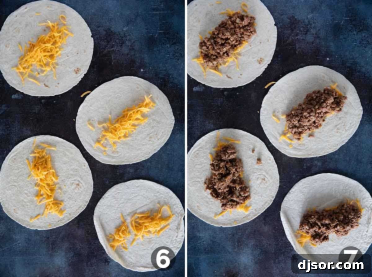 Assembling a burrito with a base of shredded cheese, followed by a generous layer of seasoned ground beef and refried bean filling, ready to be rolled.