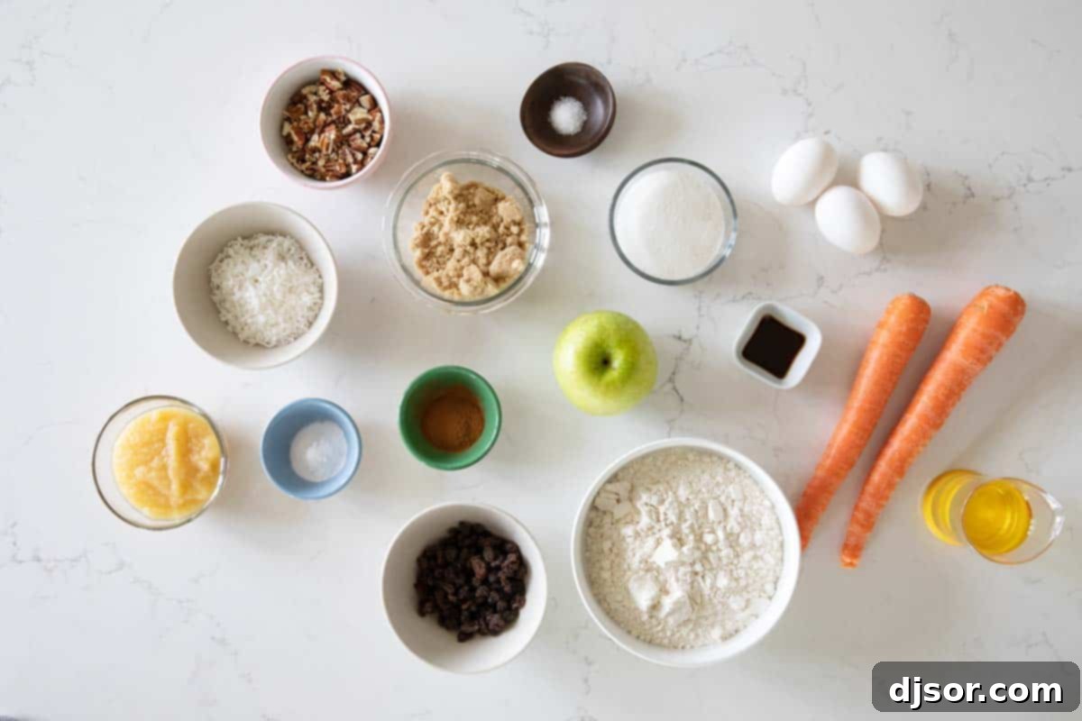 Gathering Ingredients for Morning Glory Muffins A collection of fresh ingredients laid out, including carrots, apples, flour, eggs, and spices, for making Morning Glory Muffins.