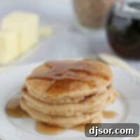 Wholesome Blender Pancakes 2 Four whole wheat blender pancakes topped with syrup