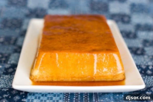 Golden-brown Coconut Banana Caramel Custard unmolded from a loaf pan